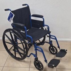 Wheelchair with Swing-Away Footrests and Flip-Back. Arms