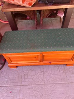 Wooden Bench with green cushion ( great for storage.