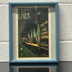 a vintage LNER "Take Me by the Flying Scotsman" railway advertisement poster. 