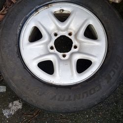 Truck tires and rims set of 4.  5 lug back country  A/T2 with nice.steel  rims  255 70 r18