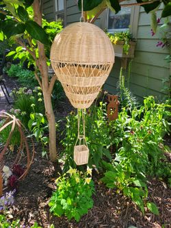 10" d  26" l hot air balloon made of wicker