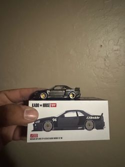 the Mini GT x Kaido House 1:64 scale Nissan Skyline GT-R (R34) Kaido Works GReddy V2 (Model KHMG222