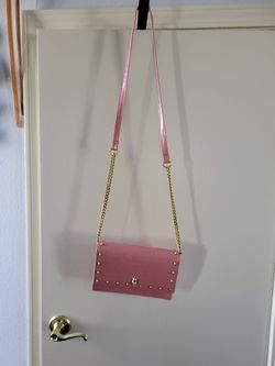 Pink Purse With A Skull On It.