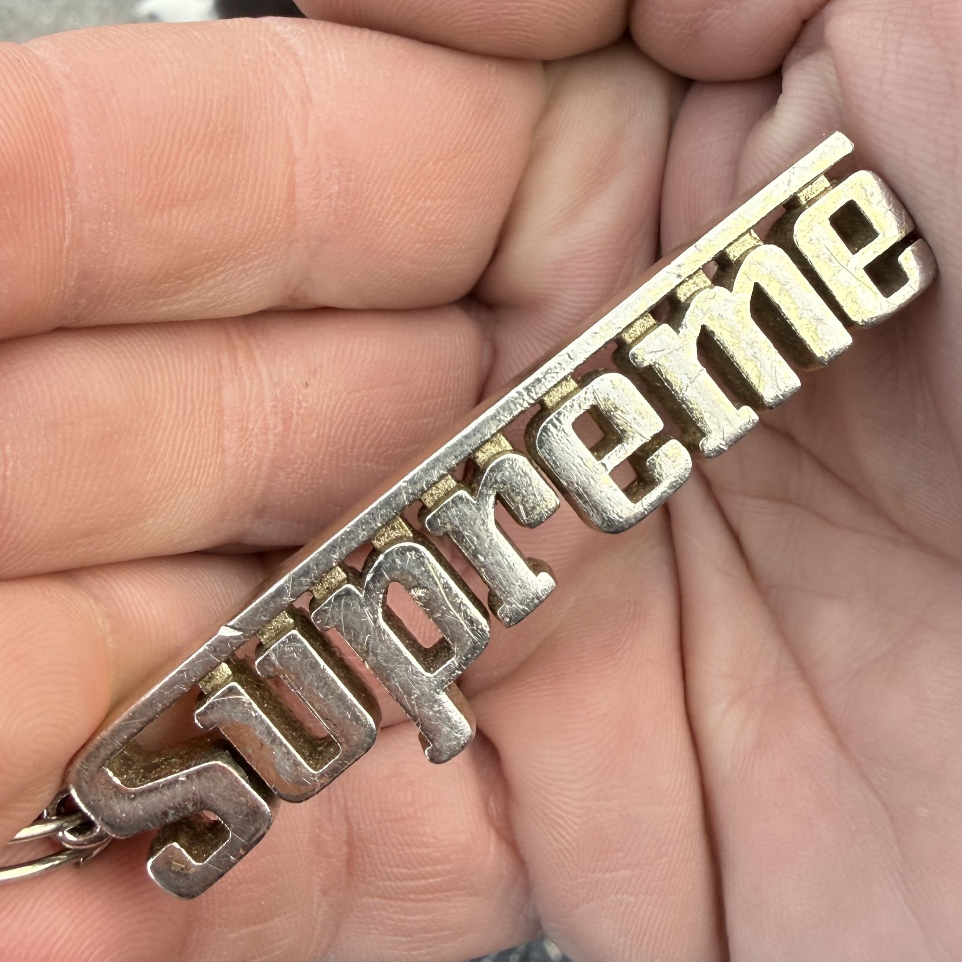 Supreme Grand Prix Faux Gold Keychain Charm