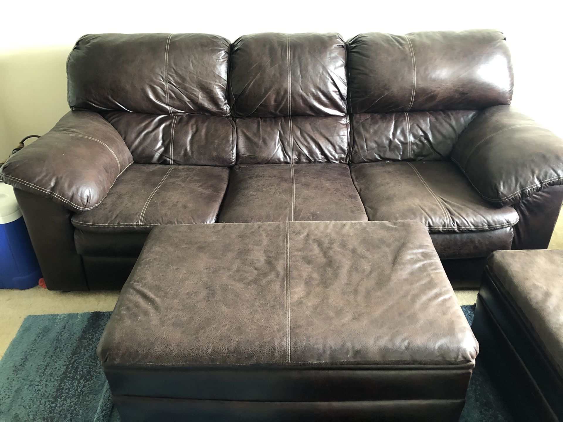 Brown couch with a storage ottoman