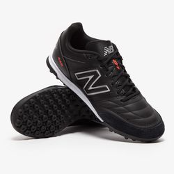 New Balance Men’s Black Turf Sneakers With Red Accents.