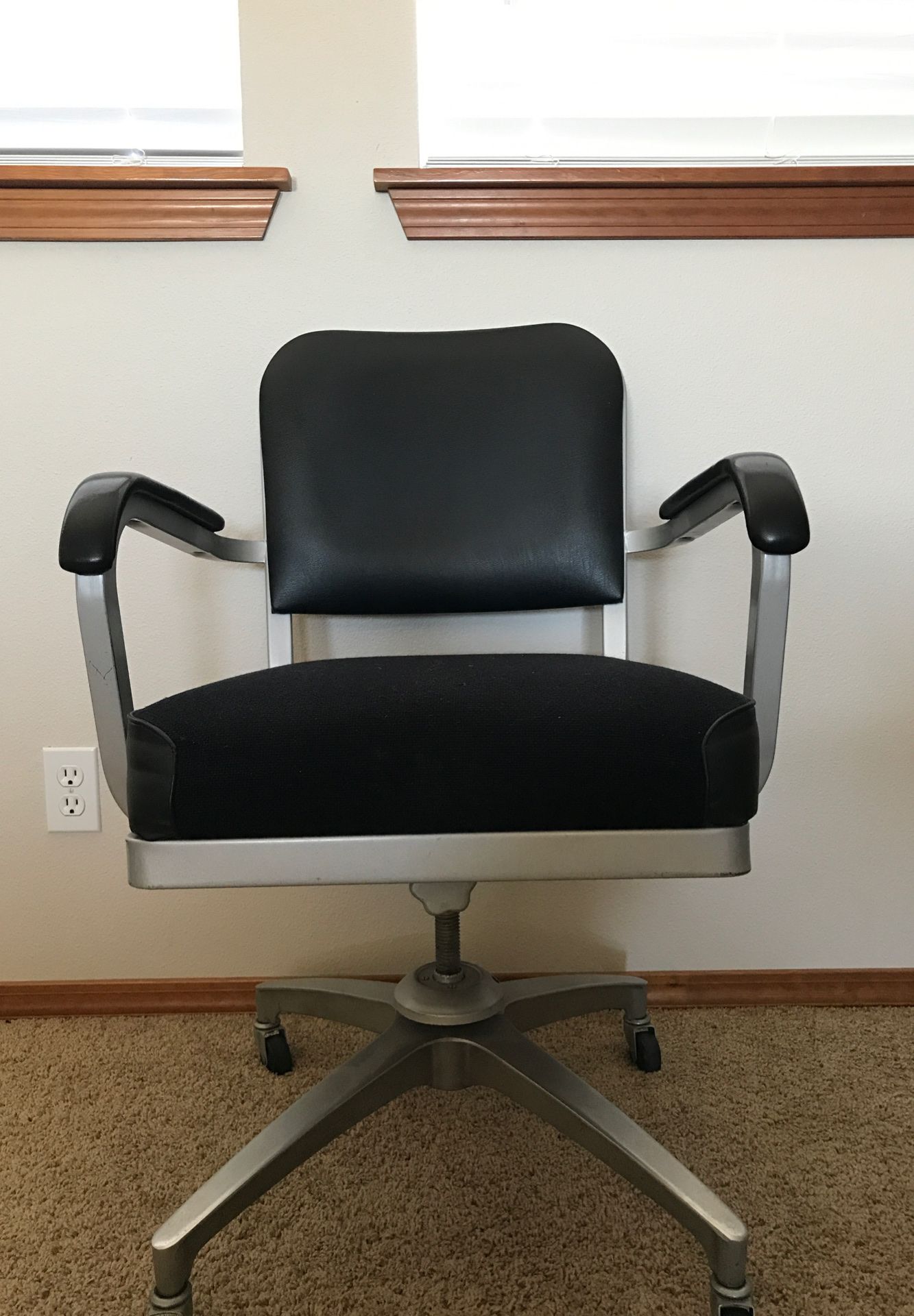 Spinning office chair with wheels.