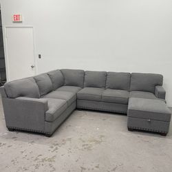 Used Gray Sectional Sofa Couch and Ottoman
