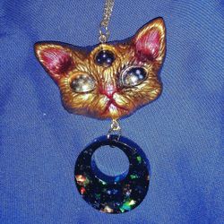 Resin necklaces and keychains.