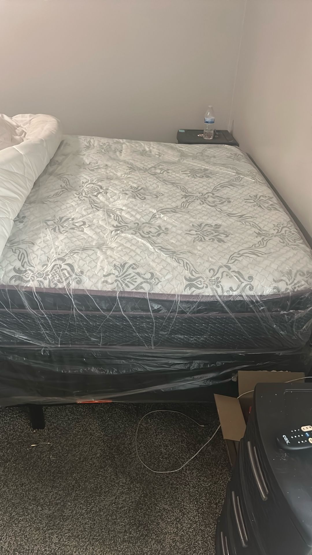 Brand new queen, size mattress, and box springs
