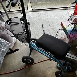 Knee scooter with basket and seat pad