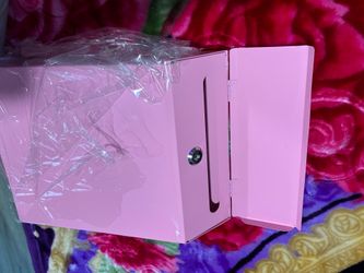 Brand new pink mailbox with key never used brand new it has hooks in the back to hang it