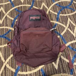 JANSPORT Maroon Black Label Superbreak Backpack with front pocket    JS00T60G  Good pre-owned condition. No tears or rips. Straps and zipper