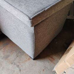 Ottoman Grey Fabric w Black Feet. Storage 