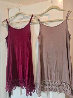 Women's ling tank tops/ layering tanksTwo long tank tops great for layering under a blouse or short dress. Both size Medium, no longer fit. One is a c