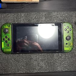 Nintendo Switch Used With A Green Transparent Mod