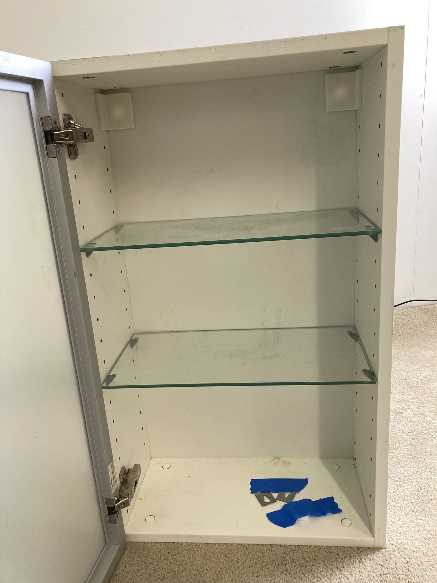 Medicine cabinet shelf supports