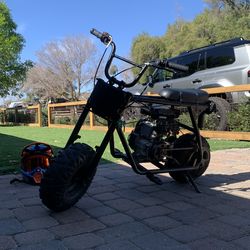 4 stroke mini gas pit bike, black frame, brand new titanium throttle, black odi plate, bike goes 40mph.