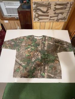 Classic Game Winner® men’s 2XL long-sleeve hunting shirt featuring a detailed Realtree® camouflage pattern with trees, branches and foliage throughout