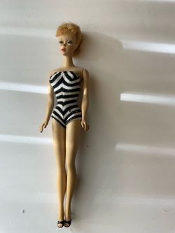 A vintage 1960 #4 Ponytail Barbie doll  Has both original shoes too