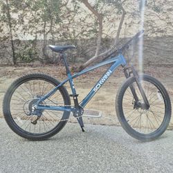 Blue Schwinn Axum Sport mountain bike with 27.5-inch wheels and aluminium frame