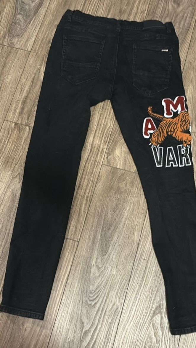 Black Amiri jeans with orange tiger design tiger design authentic
