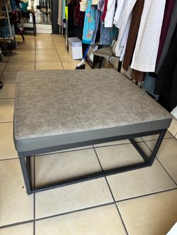 Gray Faux Leather Ottoman with Metal Base