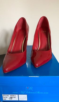 Red patent leather pumps