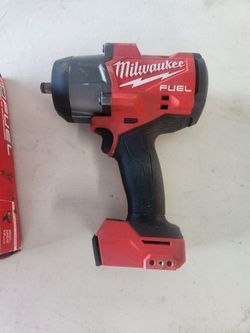 Milwaukee half inch impact 296720 almost new tool only can sell the charger and Battery separate