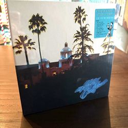 Sealed 40th Anniversary Deluxe Edition Of Hotel California By The Eagles. Contains 2 CD’s And 1 Blue Ray Audio Disc. Many Extra’s Included. 