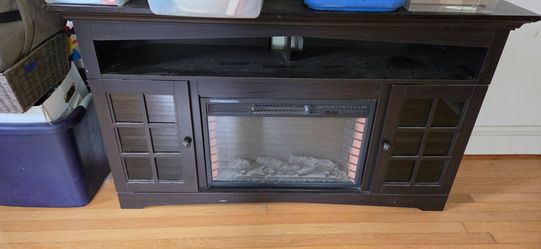 Entertainment center with built in fireplace.