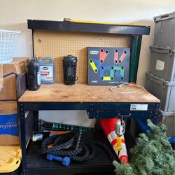 Used work bench with electrical outlets.