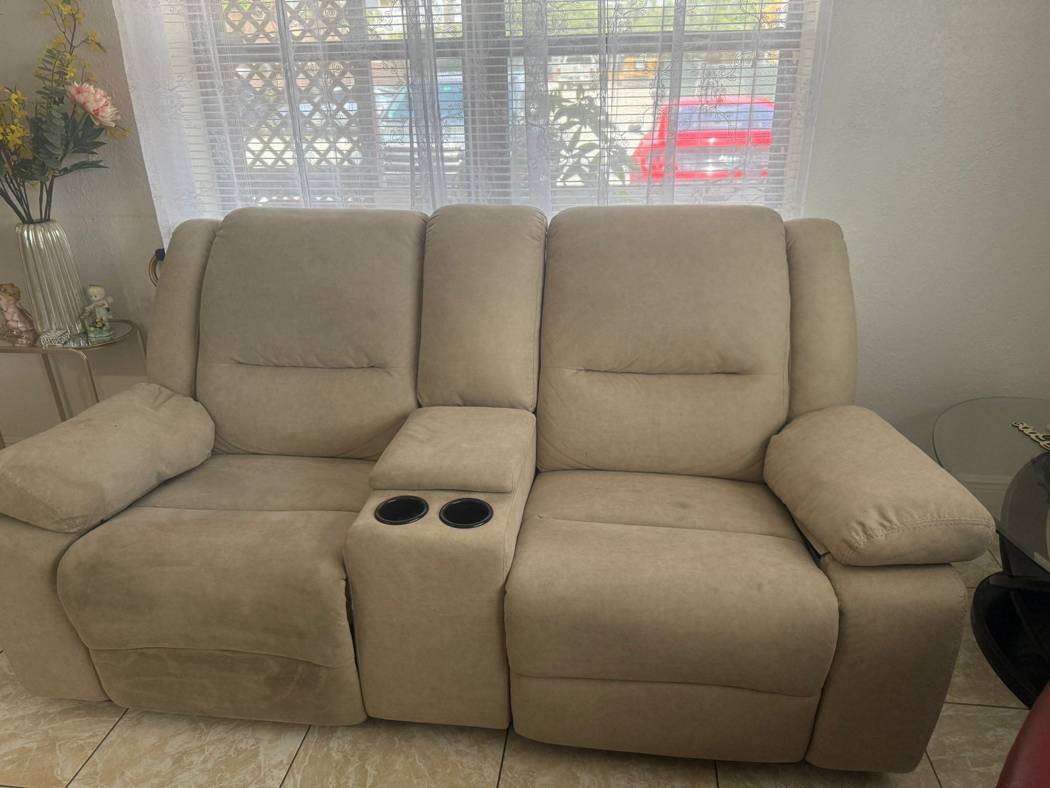 Tan loveseat and recliner