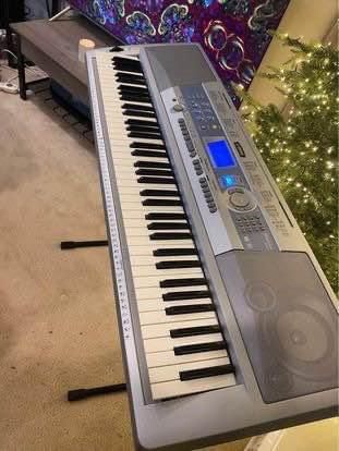 Yamaha Portable Grand 76-Key Electronic Music Keyboard with Portable Stand & Charger