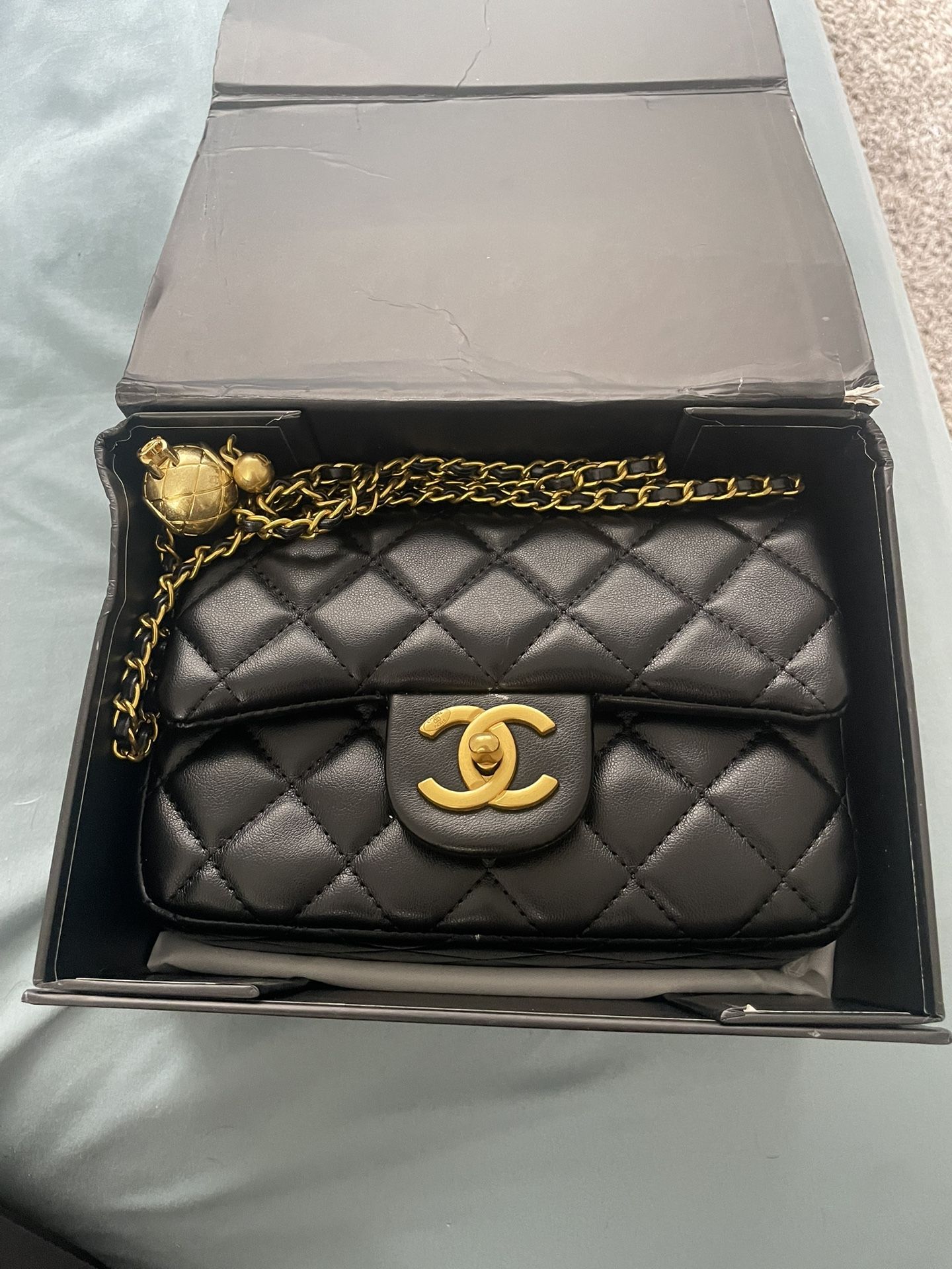 CHANEL Black Quilted Crossbody Bag with Gold Accents