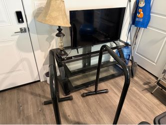 Tv stand tv and lamp , dip station
