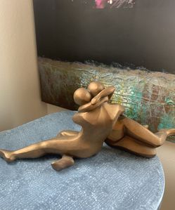 brown hugging sculpture: