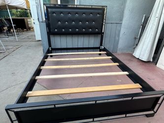 Queen Black solid wood bed frame with a black faux leather