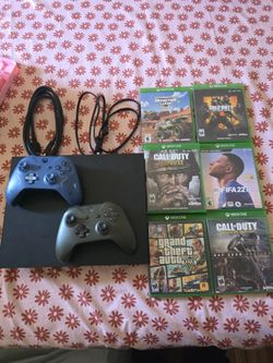 Xbox one x with 2 controllers and games