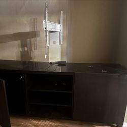 Entertainment Center With TV Holder Attachment Thing