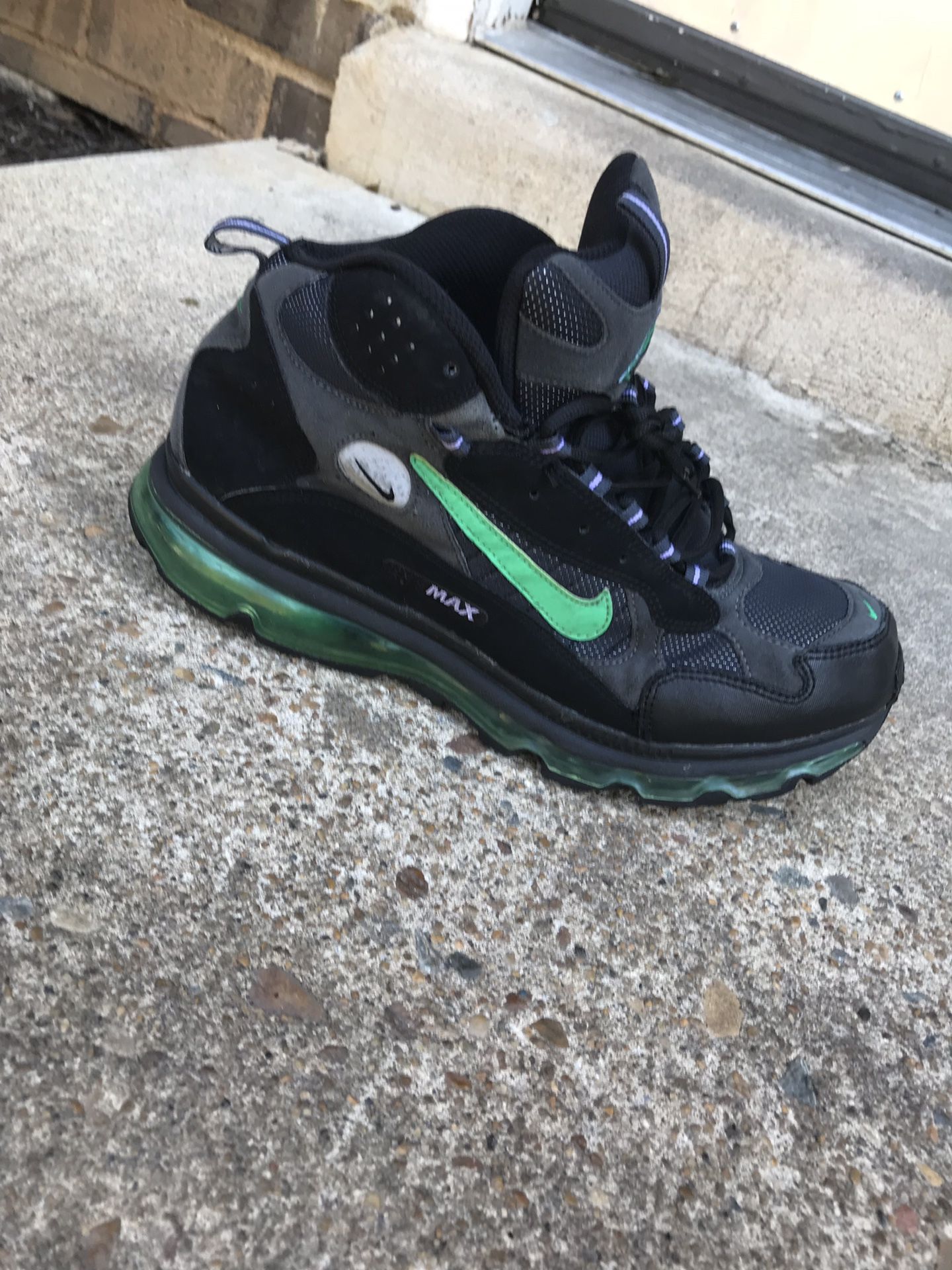 Black and green Nike air foamposite shoe