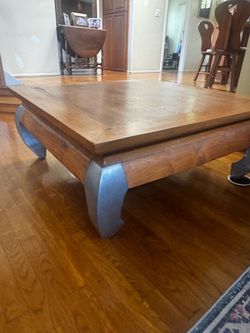 Solid wood coffee table with steel legs