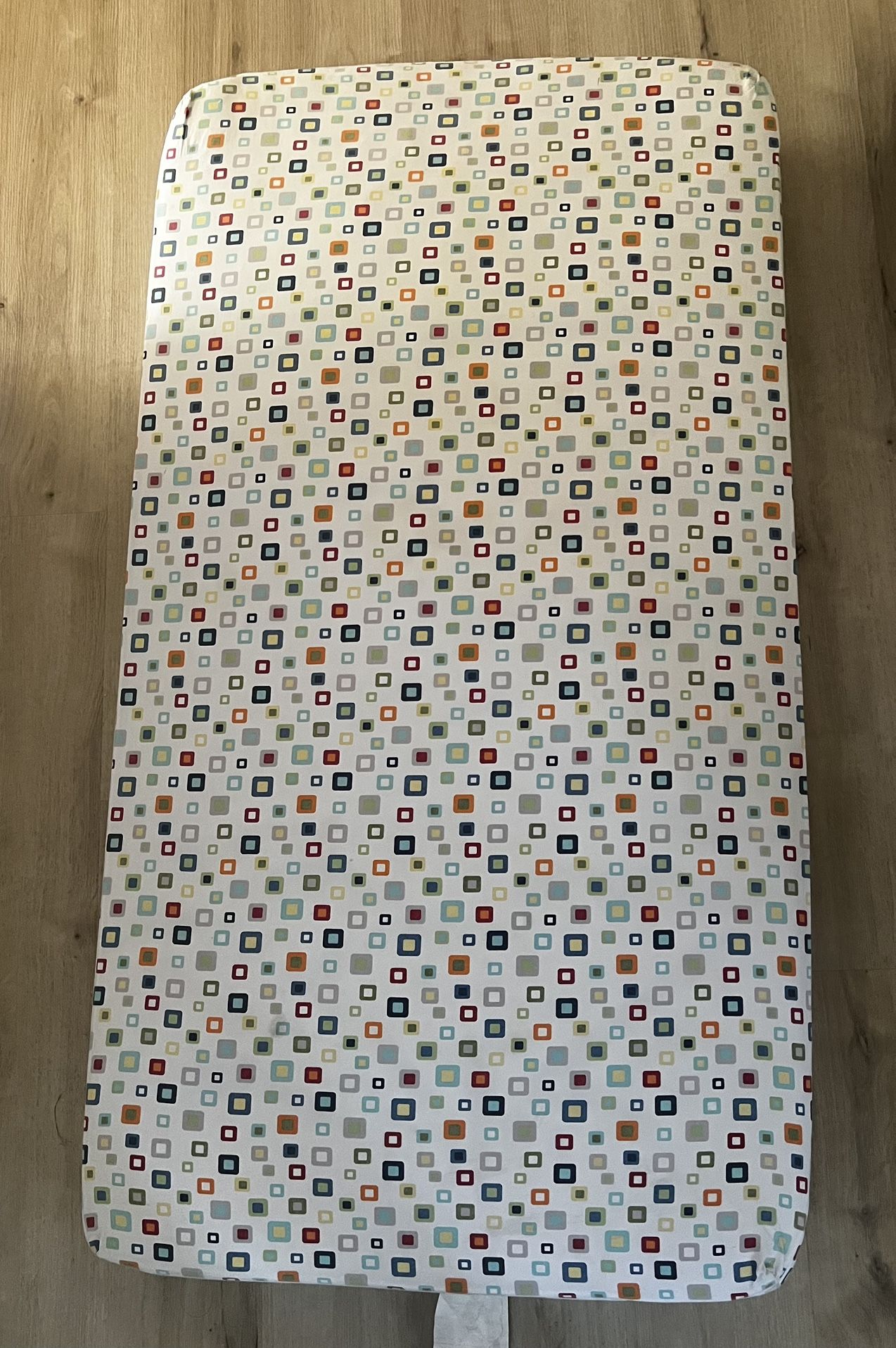 free baby crib mattress with a sheet