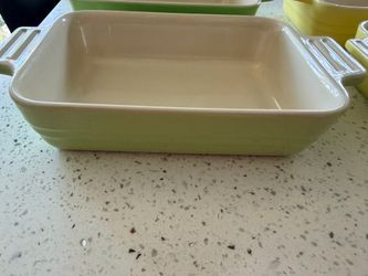 Authentic Le Creuset stoneware baking dishes.