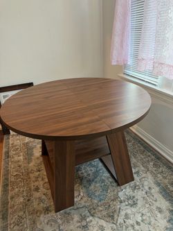 Round Wood Dining Table with extendable piece and storage