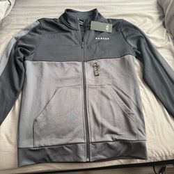 Brand New! Oakley Color Block Full Zip Up Mens Jacket. Blackout (Black). Size: M. 100% Polyester. 
