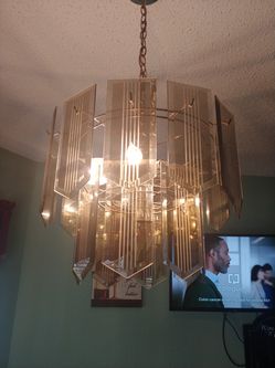 Big beautiful glass chandelier and matching smaller one.