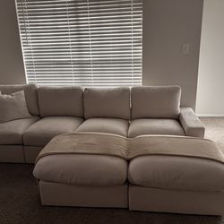Cream Couch with two Ottomans