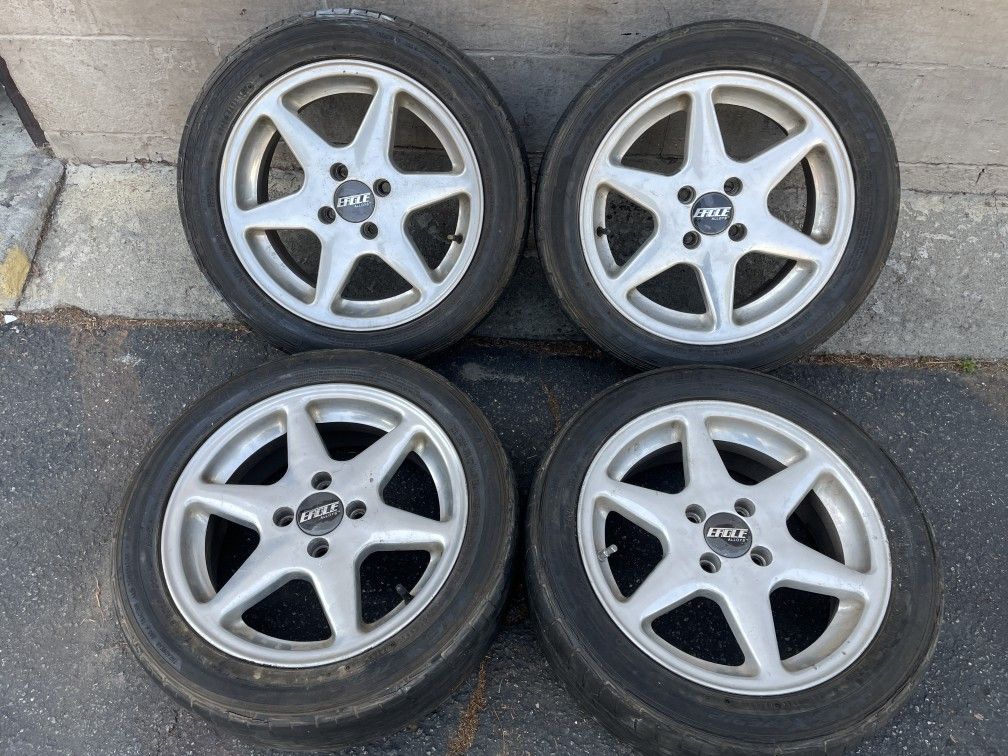 Eagle alloy 15 inch 4 lug rims with old tires 4x100mm