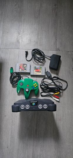 Nintendo 64 with 1 green controller amd 2 games